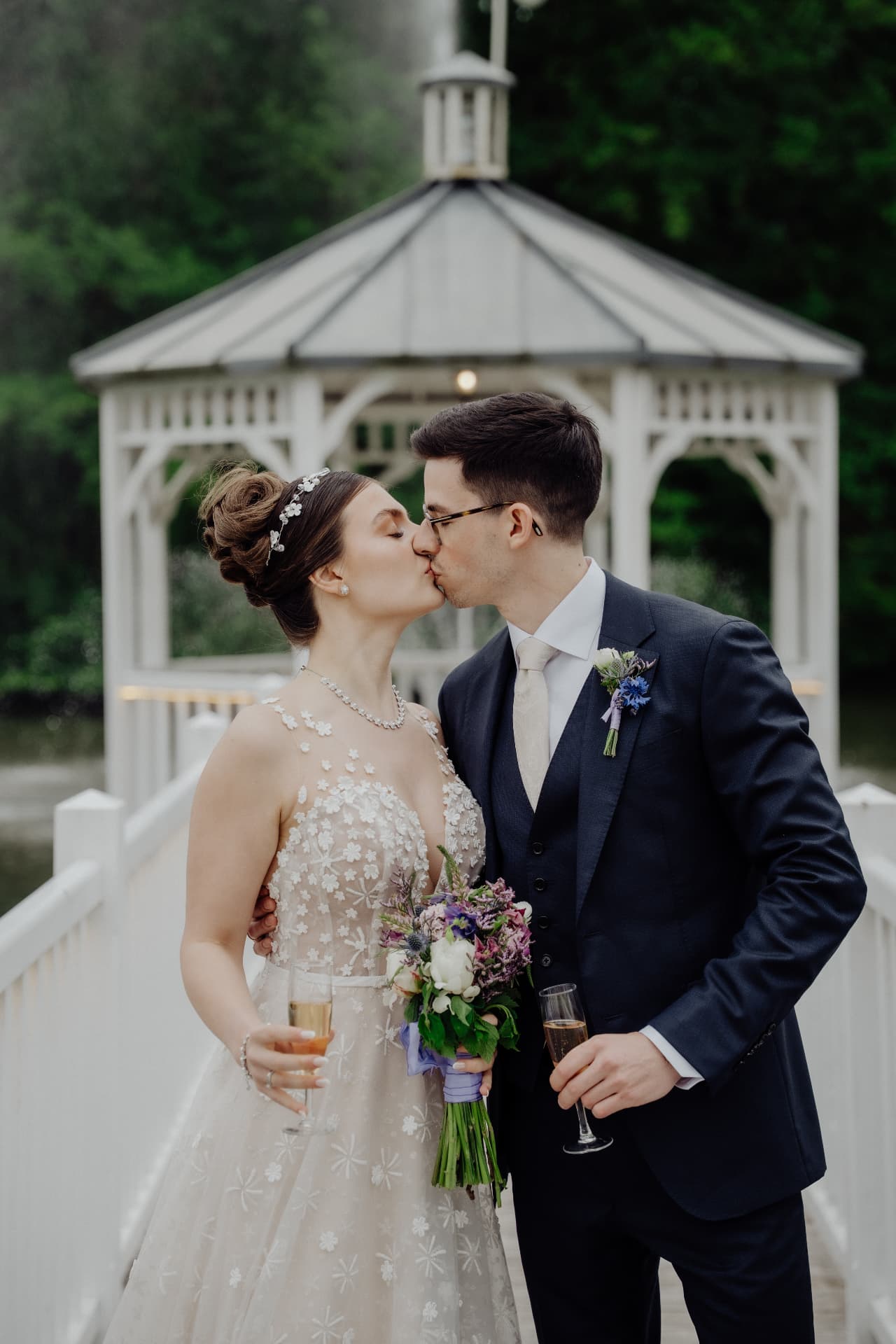 Couple toasting by the gazebo