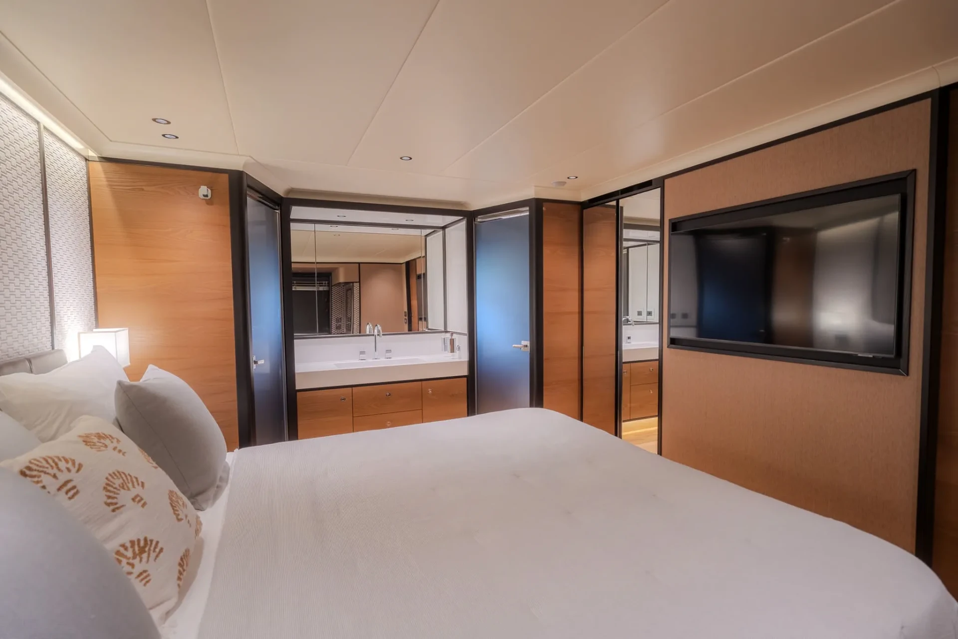 Master cabin in warm oak and linen