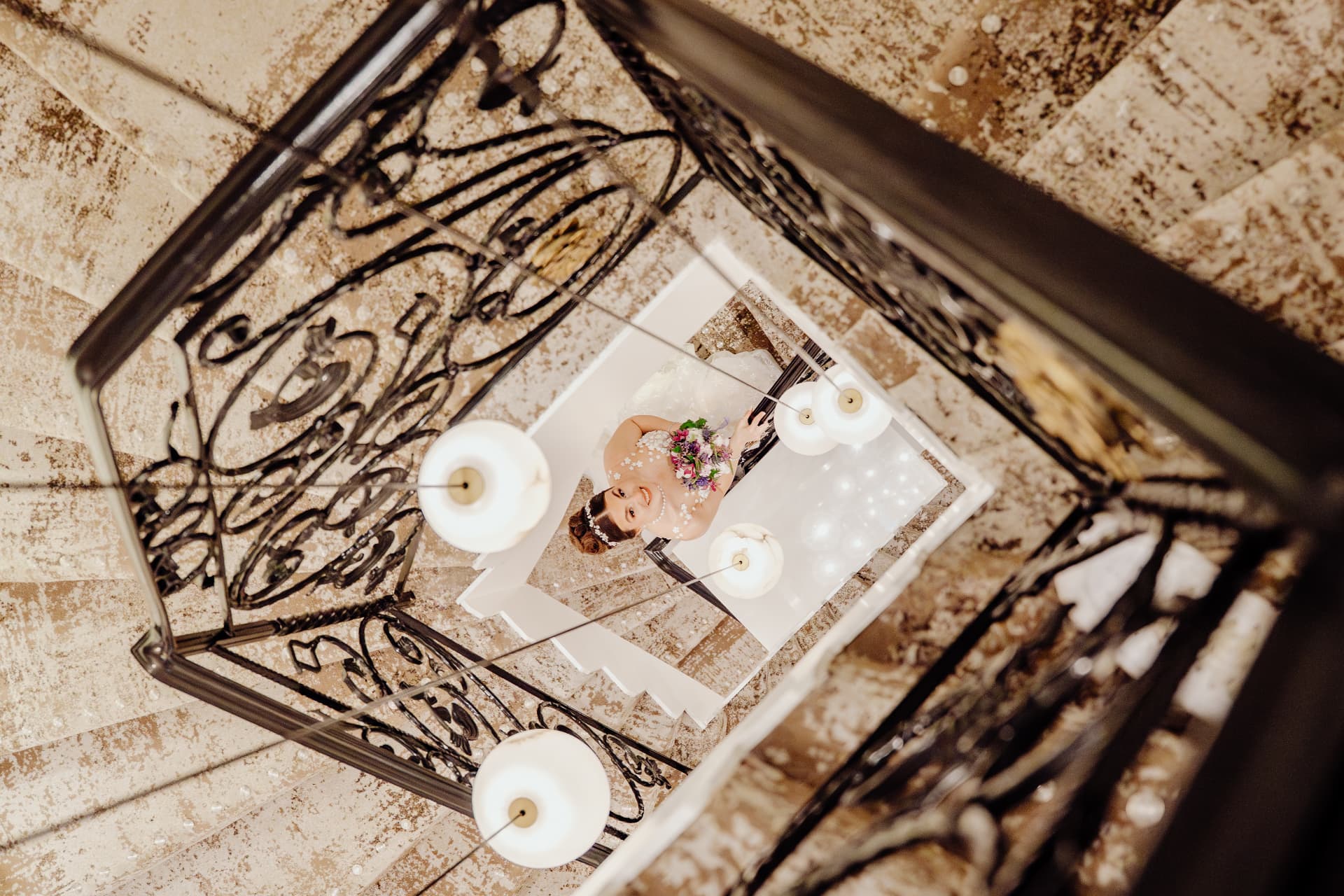 Bride seen from above in the stairwell