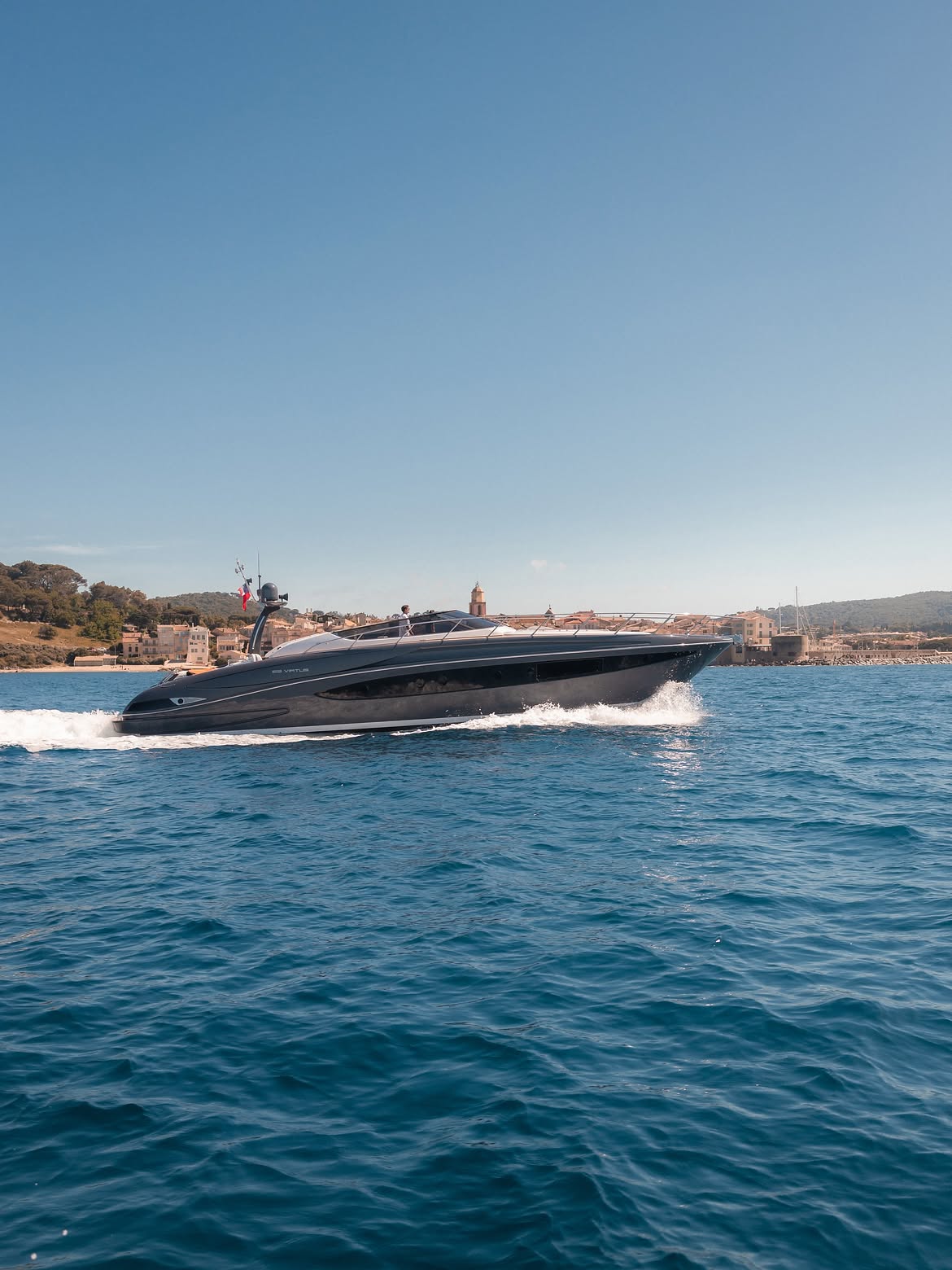 Yacht cruising past the coastline