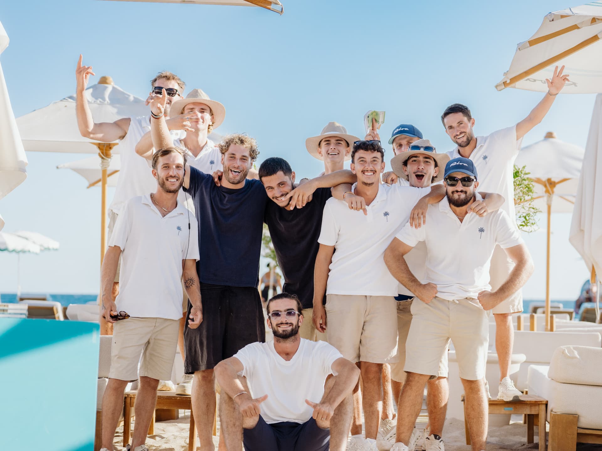 Beach club team by the pool