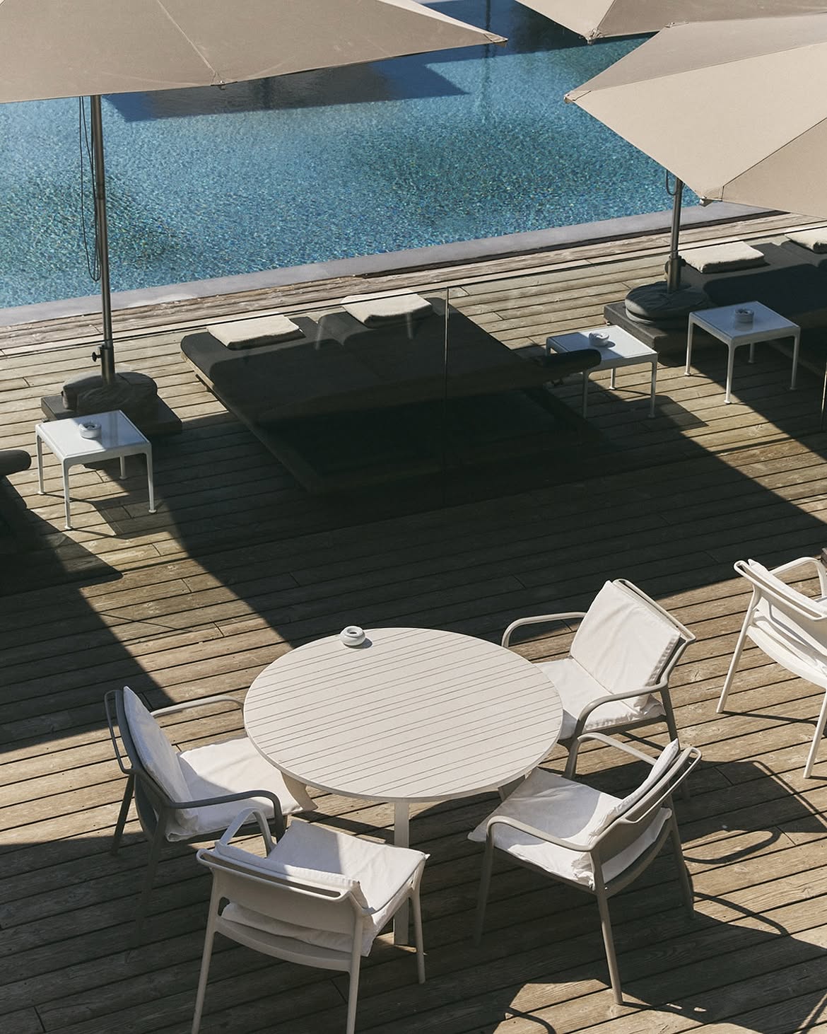 Poolside terrace with daybeds